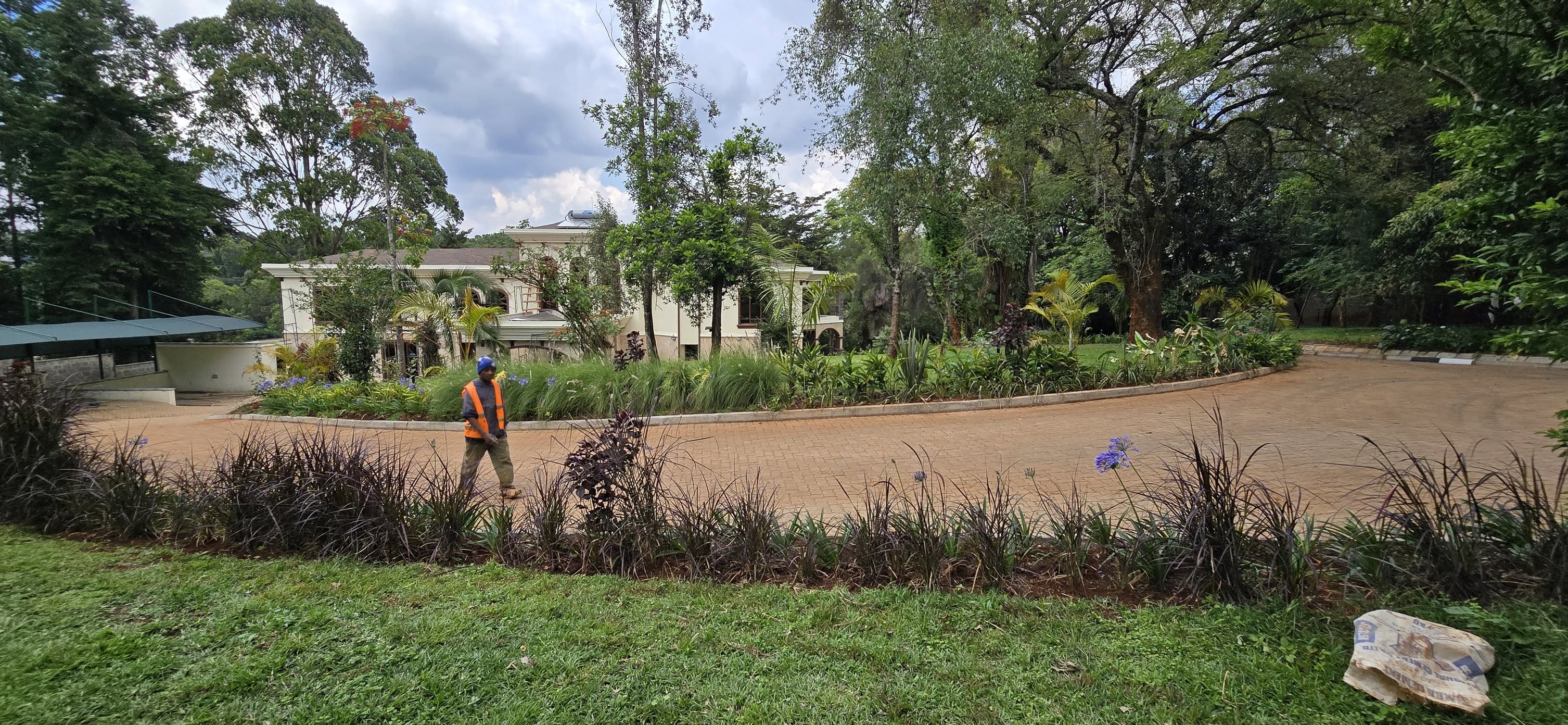 Well-maintained lawn and landscaped entrance of a modern home